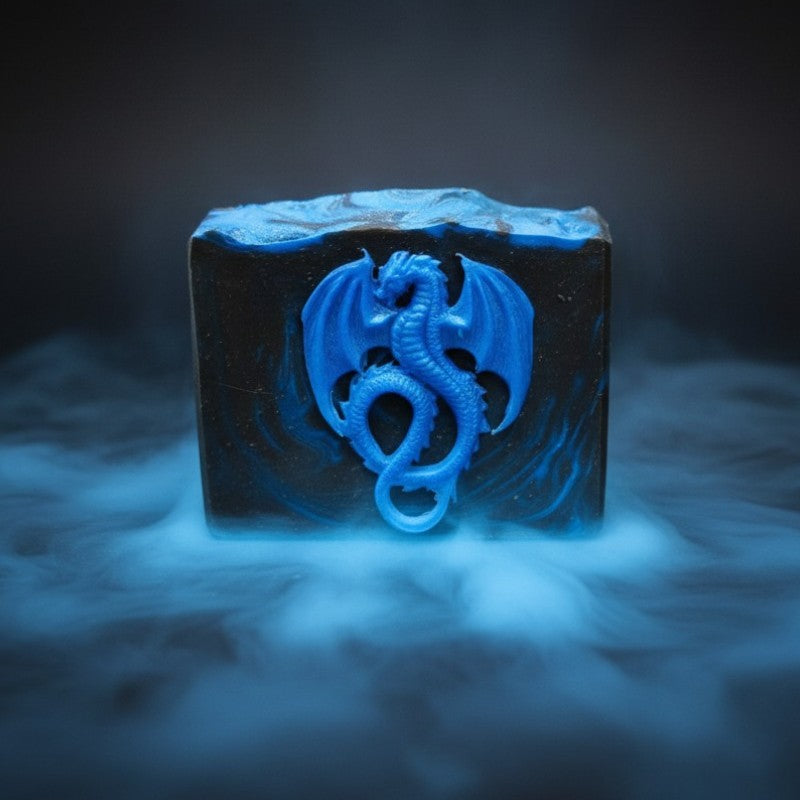 A black soap with blue swirls with a blue dragon on the front