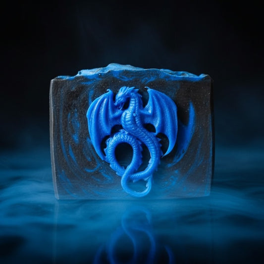 A black soap with blue swirls with a blue dragon on the front