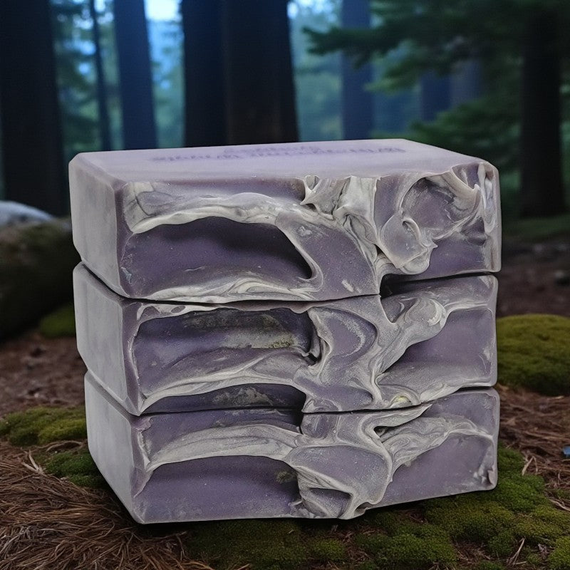 Stack of purple soap bars on a natural background
