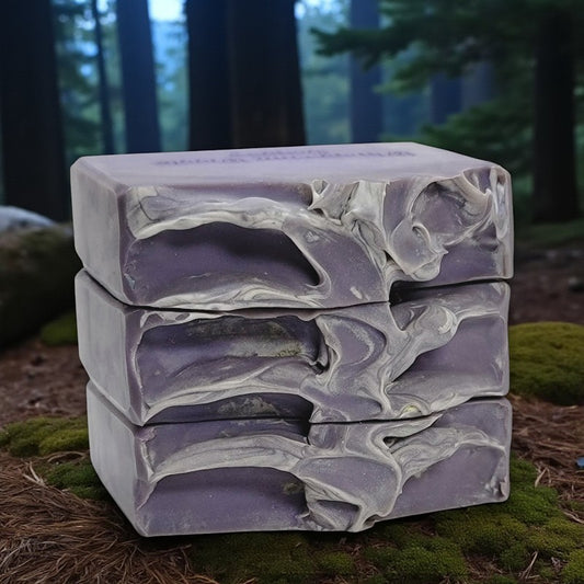 Stack of purple soap bars on a natural background