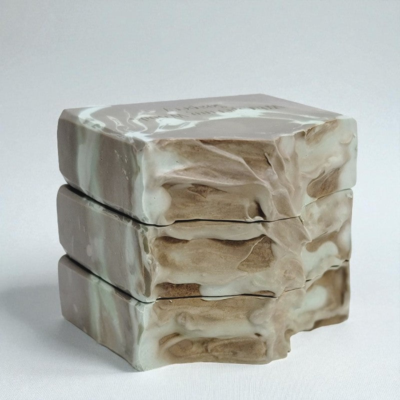 Marble-patterned soap stack on a light gray background