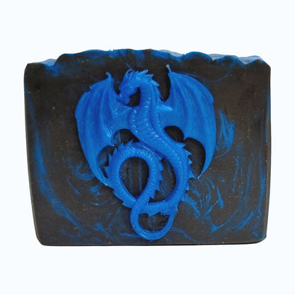 Black and blue bar of soap with a blue dragon design on a white background