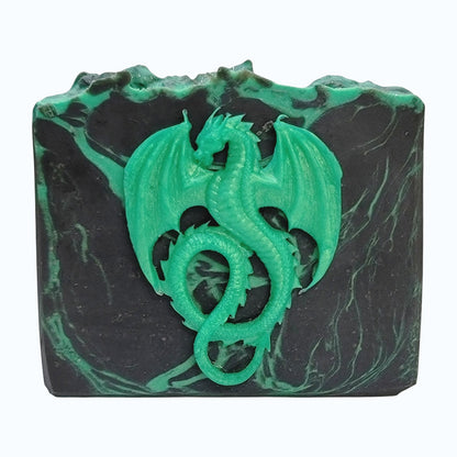 Black and green bar of soap with a green dragon design on a white background