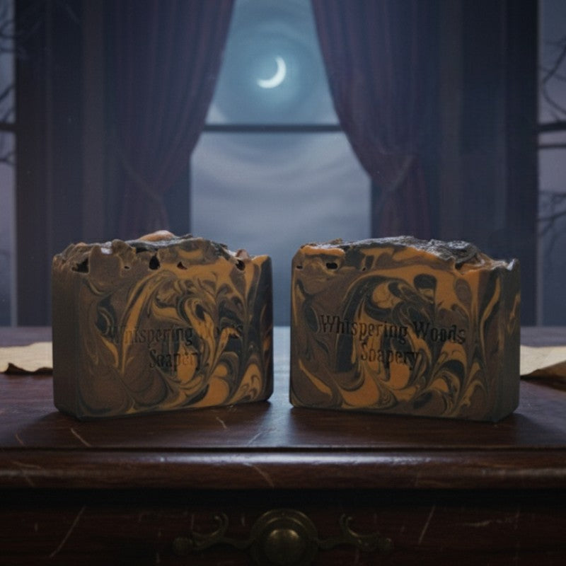 Two bars of soap with marbled design on a wooden surface, moonlit background