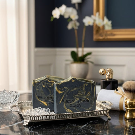 Two soap bars on a decorative tray with a blurred background of a bathroom setting